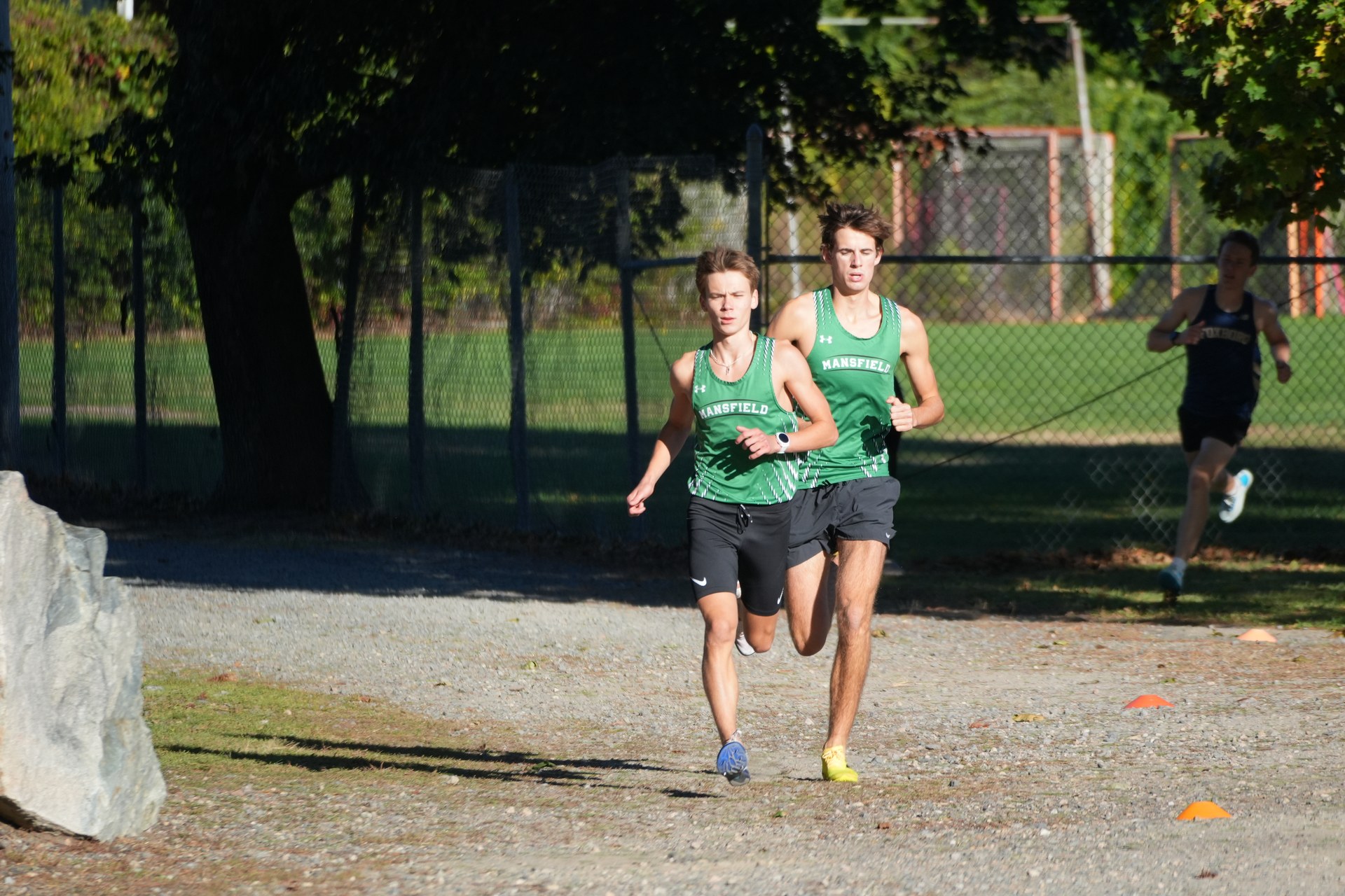 Mansfield runners approach the fence together.