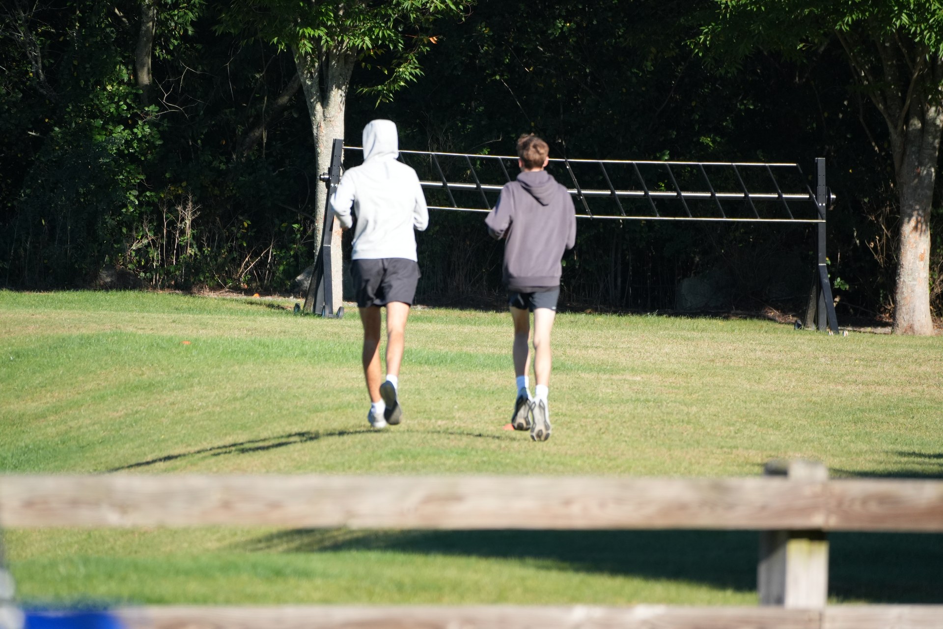 An early jog around the grounds, still in hoodies.